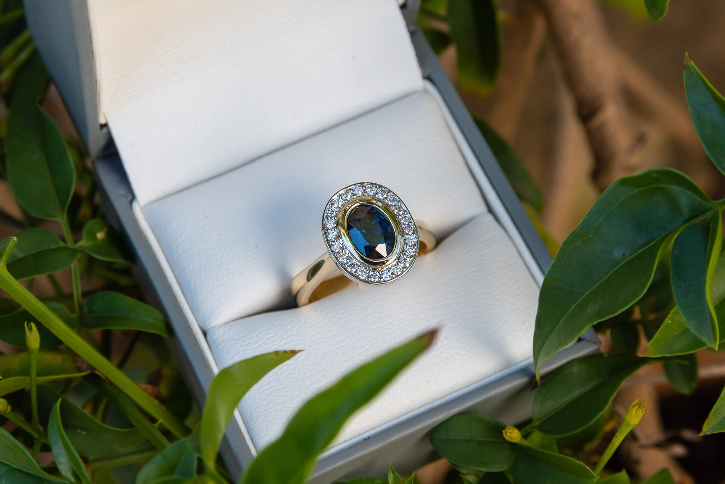 Oval Australian Sapphire and Diamond cluster.